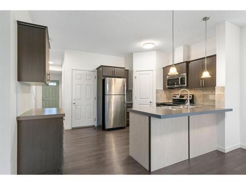 118 Copperpond Landing Se, Calgary, AB - Indoor Photo Showing Kitchen With Stainless Steel Kitchen With Double Sink With Upgraded Kitchen