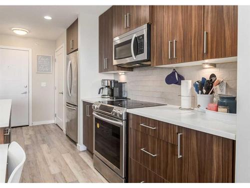 408-8531 8A Avenue Sw, Calgary, AB - Indoor Photo Showing Kitchen With Stainless Steel Kitchen