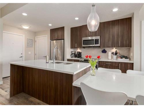 408-8531 8A Avenue Sw, Calgary, AB - Indoor Photo Showing Kitchen With Stainless Steel Kitchen With Double Sink With Upgraded Kitchen