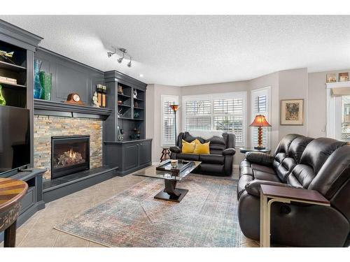 306 Douglas Park Boulevard Se, Calgary, AB - Indoor Photo Showing Living Room With Fireplace