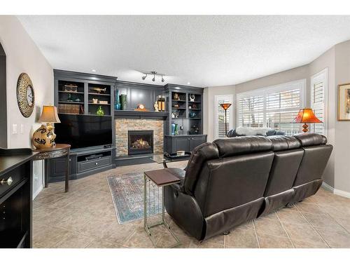 306 Douglas Park Boulevard Se, Calgary, AB - Indoor Photo Showing Living Room With Fireplace