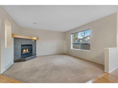 143 Brightondale Crescent Se, Calgary, AB - Indoor Photo Showing Other Room With Fireplace