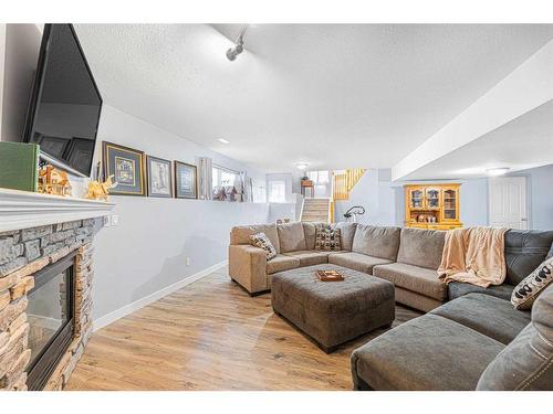 151 Somerglen Common Sw, Calgary, AB - Indoor Photo Showing Living Room With Fireplace