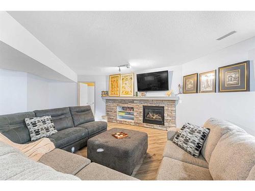 151 Somerglen Common Sw, Calgary, AB - Indoor Photo Showing Living Room With Fireplace