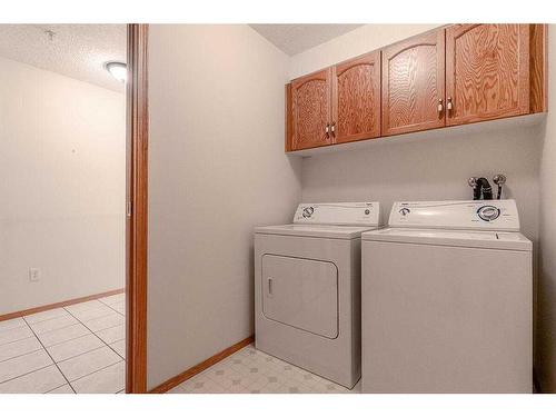 211-7239 Sierra Morena Boulevard Sw, Calgary, AB - Indoor Photo Showing Laundry Room