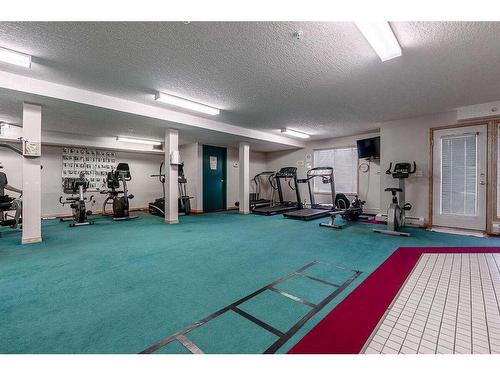 211-7239 Sierra Morena Boulevard Sw, Calgary, AB - Indoor Photo Showing Gym Room