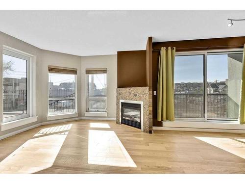 203-108 15 Avenue Se, Calgary, AB - Indoor With Fireplace