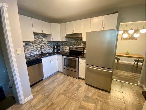 3734 42 Street Sw, Calgary, AB - Indoor Photo Showing Kitchen With Double Sink