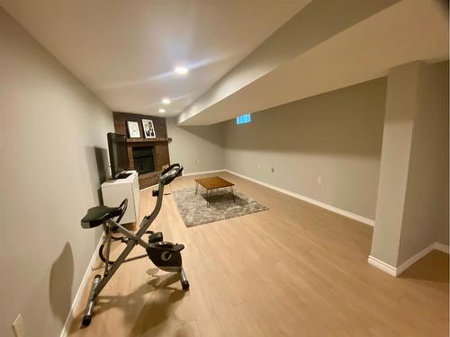 3734 42 Street Sw, Calgary, AB - Indoor Photo Showing Gym Room