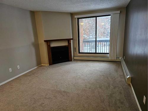 201B-7301 4A Street Sw, Calgary, AB - Indoor With Fireplace