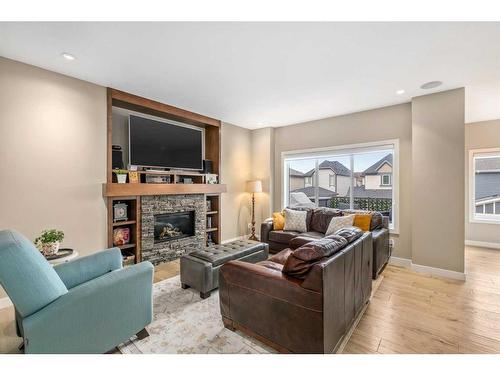 18 Masters Mews Se, Calgary, AB - Indoor Photo Showing Living Room With Fireplace