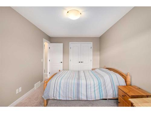 18 Masters Mews Se, Calgary, AB - Indoor Photo Showing Bedroom