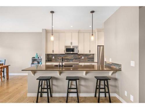 18 Masters Mews Se, Calgary, AB - Indoor Photo Showing Kitchen With Stainless Steel Kitchen With Upgraded Kitchen