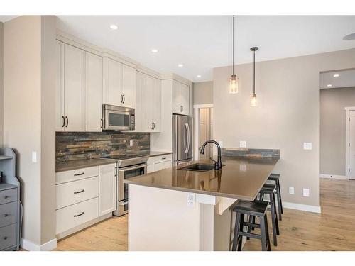 18 Masters Mews Se, Calgary, AB - Indoor Photo Showing Kitchen With Stainless Steel Kitchen With Upgraded Kitchen