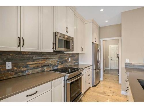 18 Masters Mews Se, Calgary, AB - Indoor Photo Showing Kitchen With Stainless Steel Kitchen With Upgraded Kitchen