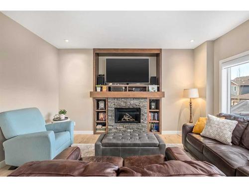 18 Masters Mews Se, Calgary, AB - Indoor Photo Showing Living Room With Fireplace