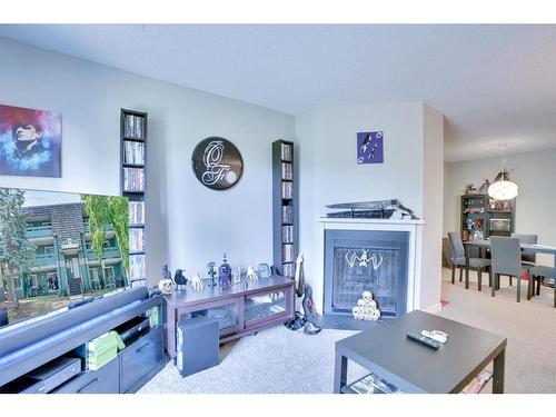 9203-315 Southampton Drive Sw, Calgary, AB - Indoor Photo Showing Living Room With Fireplace