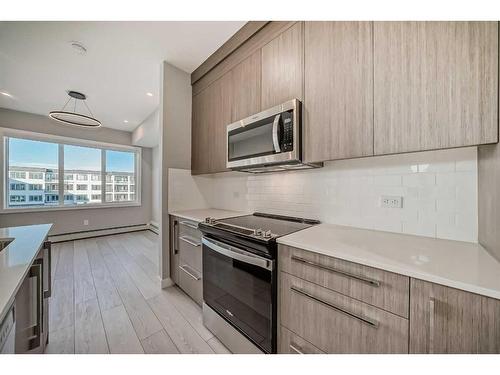 3414-111 Wolf Creek Drive Se, Calgary, AB - Indoor Photo Showing Kitchen With Upgraded Kitchen