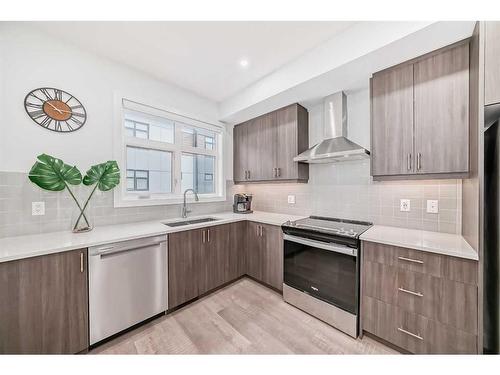 402-8235 8 Ave, Calgary, AB - Indoor Photo Showing Kitchen With Stainless Steel Kitchen