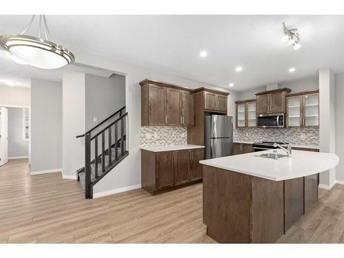 137 Osborne Common Sw, Airdrie, AB - Indoor Photo Showing Kitchen With Double Sink With Upgraded Kitchen