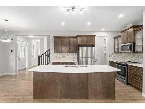 137 Osborne Common Sw, Airdrie, AB - Indoor Photo Showing Kitchen With Double Sink With Upgraded Kitchen