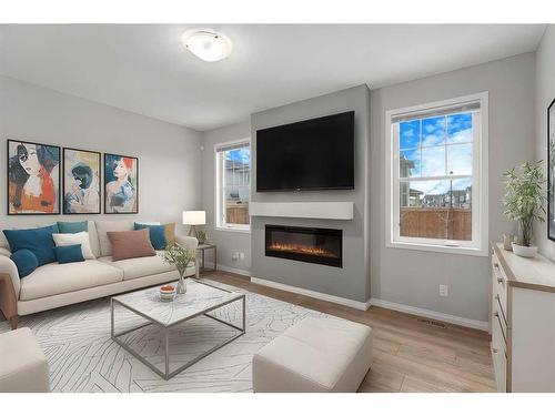 137 Osborne Common Sw, Airdrie, AB - Indoor Photo Showing Living Room With Fireplace