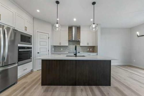 1026 Fowler Road, Airdrie, AB - Indoor Photo Showing Kitchen With Upgraded Kitchen