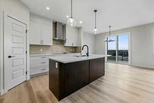 1026 Fowler Road, Airdrie, AB - Indoor Photo Showing Kitchen With Upgraded Kitchen