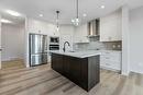 1026 Fowler Road, Airdrie, AB  - Indoor Photo Showing Kitchen With Upgraded Kitchen 