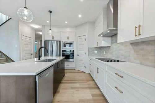 1026 Fowler Road, Airdrie, AB - Indoor Photo Showing Kitchen With Upgraded Kitchen