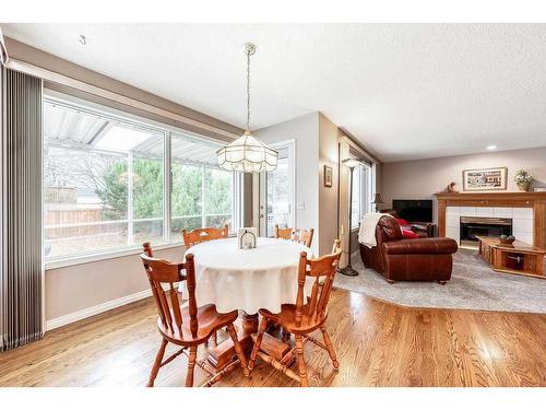 2256 Douglasbank Crescent Se, Calgary, AB - Indoor Photo Showing Dining Room With Fireplace