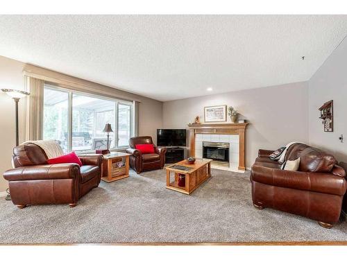 2256 Douglasbank Crescent Se, Calgary, AB - Indoor Photo Showing Living Room With Fireplace