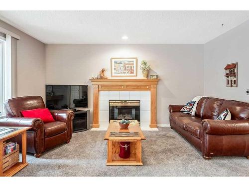 2256 Douglasbank Crescent Se, Calgary, AB - Indoor Photo Showing Living Room With Fireplace