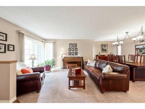 2256 Douglasbank Crescent Se, Calgary, AB - Indoor Photo Showing Living Room With Fireplace