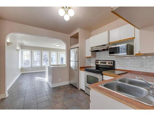 205 19 Avenue Nw, Calgary, AB - Indoor Photo Showing Kitchen With Double Sink