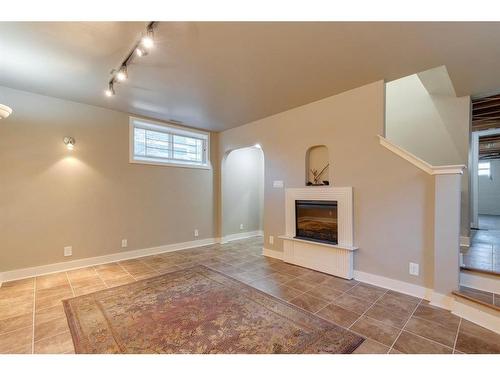 205 19 Avenue Nw, Calgary, AB - Indoor Photo Showing Other Room With Fireplace