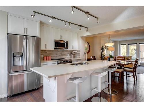 203 Auburn Meadows Se, Calgary, AB - Indoor Photo Showing Kitchen With Stainless Steel Kitchen With Double Sink