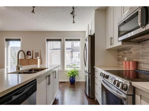 203 Auburn Meadows Se, Calgary, AB - Indoor Photo Showing Kitchen With Stainless Steel Kitchen With Double Sink With Upgraded Kitchen