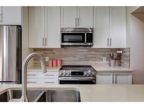 203 Auburn Meadows Se, Calgary, AB - Indoor Photo Showing Kitchen With Stainless Steel Kitchen With Double Sink With Upgraded Kitchen