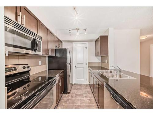 1113-625 Glenbow Drive, Cochrane, AB - Indoor Photo Showing Kitchen With Double Sink