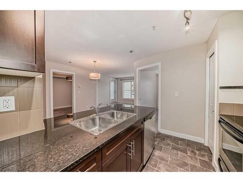 1113-625 Glenbow Drive, Cochrane, AB - Indoor Photo Showing Kitchen With Double Sink