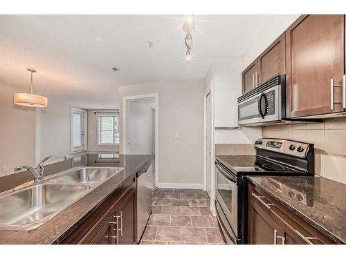 1113-625 Glenbow Drive, Cochrane, AB - Indoor Photo Showing Kitchen With Double Sink