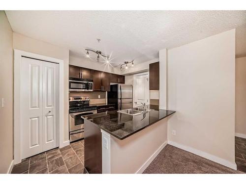 1113-625 Glenbow Drive, Cochrane, AB - Indoor Photo Showing Kitchen With Double Sink