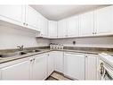 334-5000 Somervale Court Sw, Calgary, AB  - Indoor Photo Showing Kitchen With Double Sink 