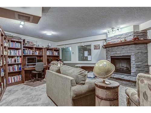 334-5000 Somervale Court Sw, Calgary, AB - Indoor With Fireplace