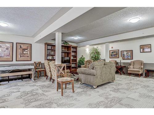 334-5000 Somervale Court Sw, Calgary, AB - Indoor With Fireplace