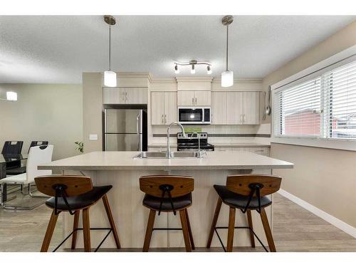 115 Fireside Parkway, Cochrane, AB - Indoor Photo Showing Kitchen With Upgraded Kitchen