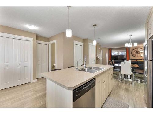 115 Fireside Parkway, Cochrane, AB - Indoor Photo Showing Kitchen With Double Sink