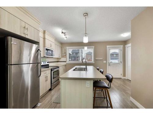 115 Fireside Parkway, Cochrane, AB - Indoor Photo Showing Kitchen With Double Sink