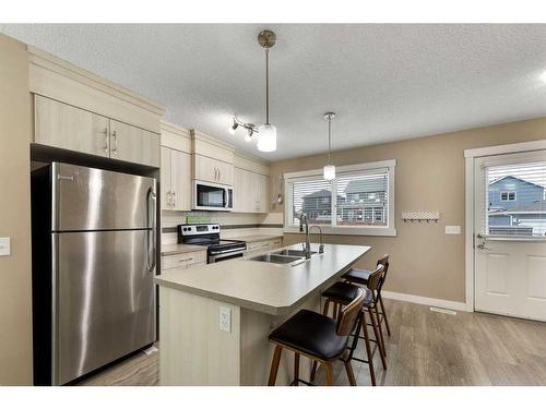 115 Fireside Parkway, Cochrane, AB - Indoor Photo Showing Kitchen With Double Sink